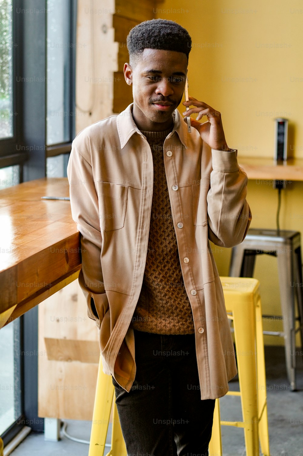 a man in a brown jacket