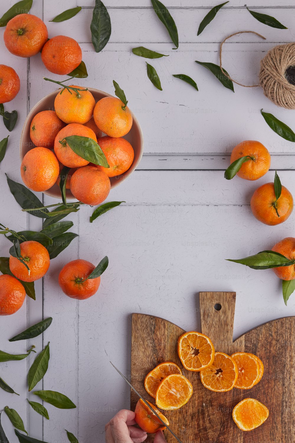 a group of oranges on a branch