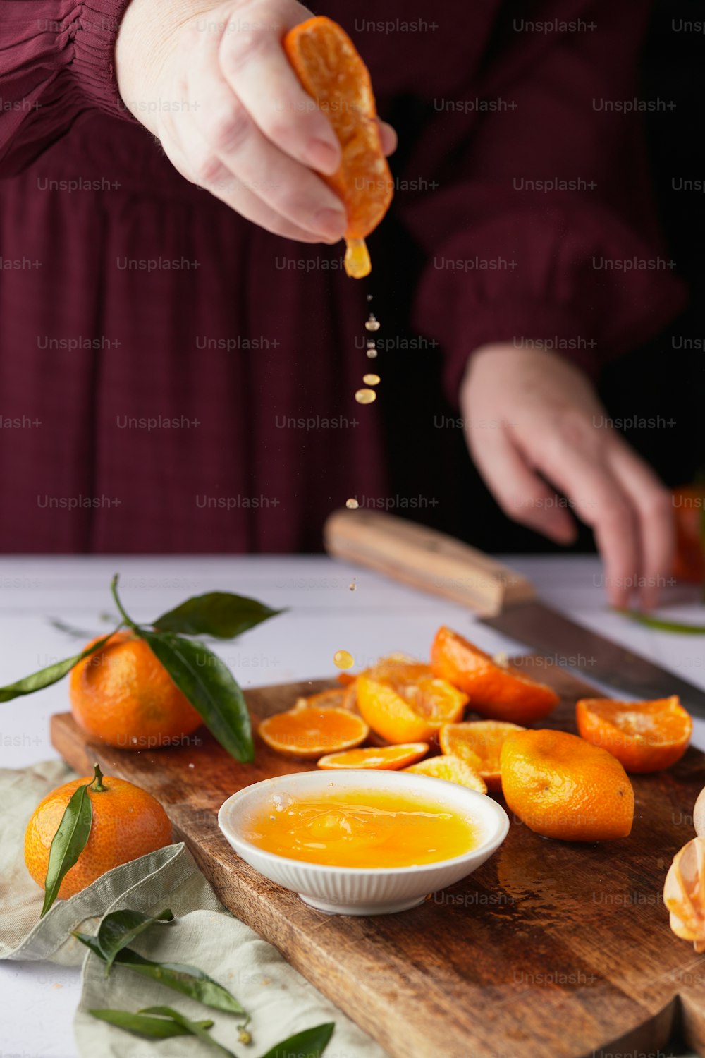 a person cutting a fruit