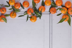 a bunch of oranges on a branch