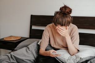 a person sitting on a bed