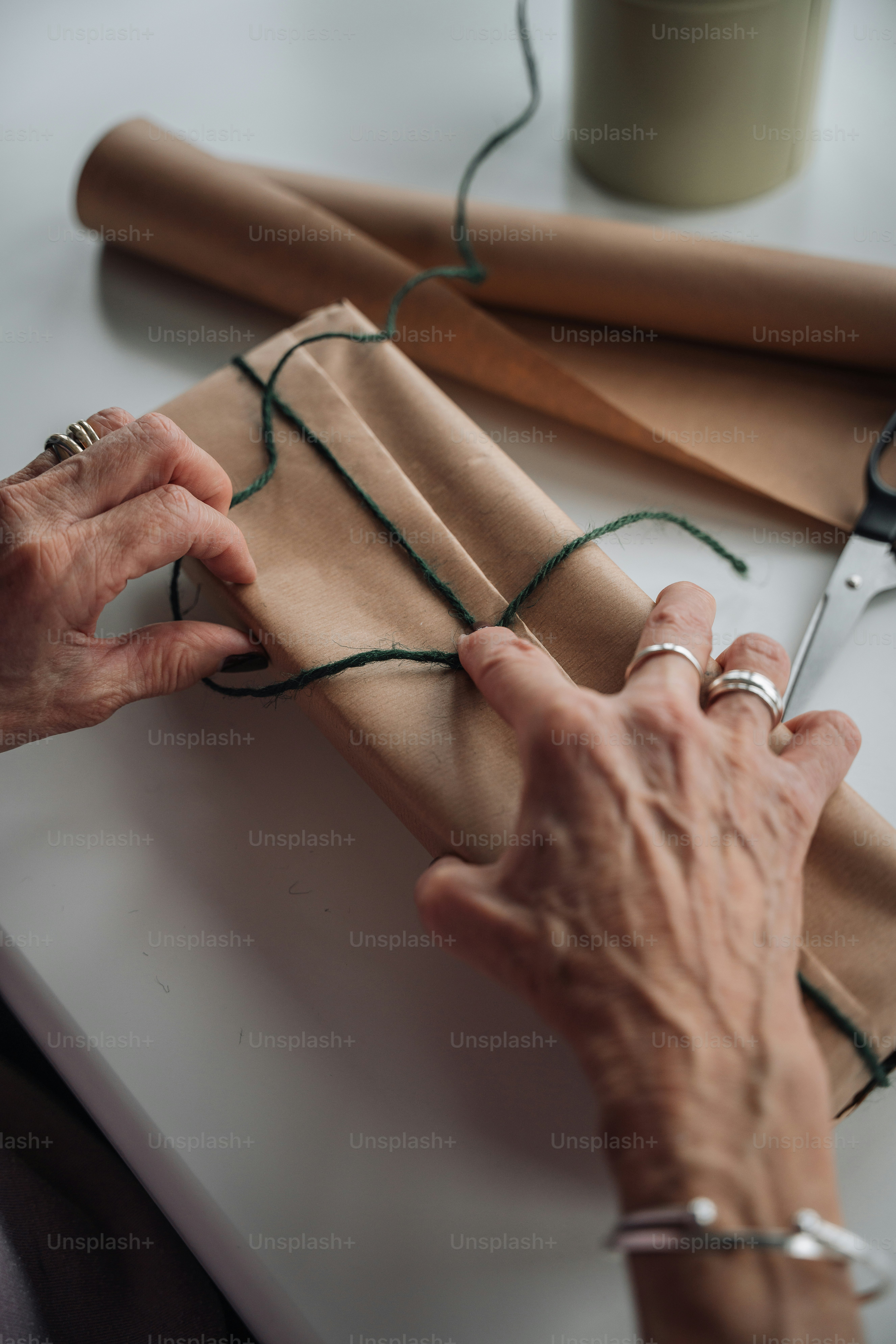 a person holding a pair of scissors