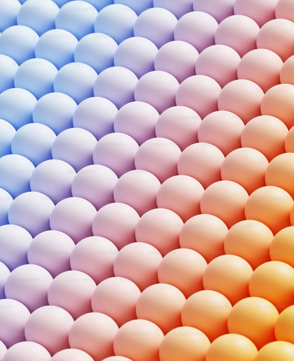 a large pile of pink and white eggs