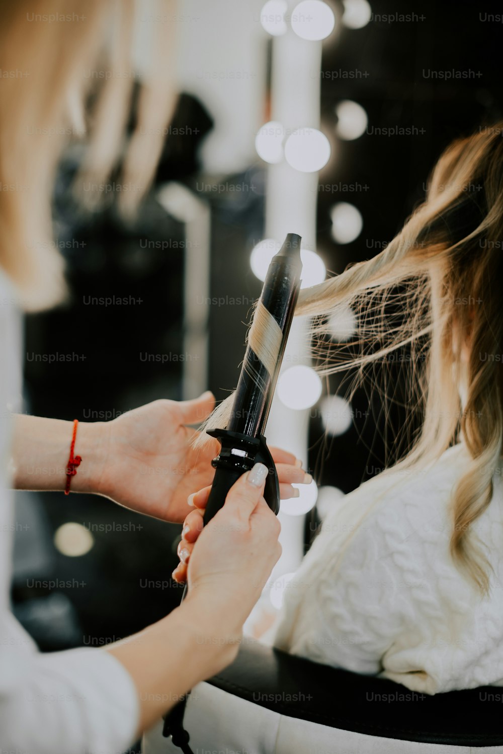 a woman cutting her hair