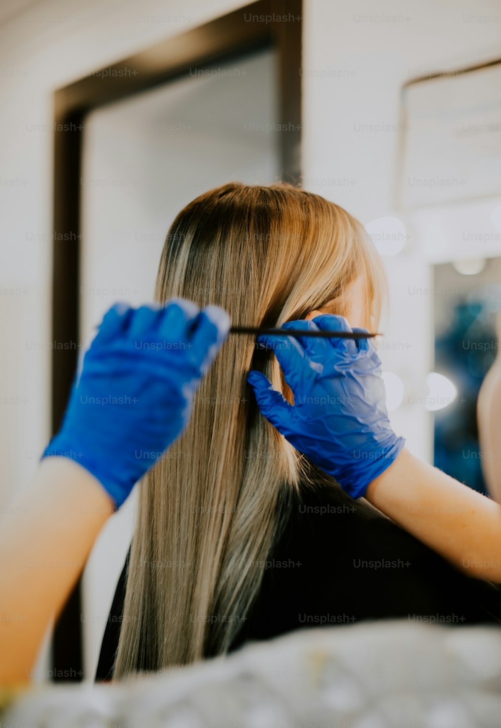 a person with blue gloves