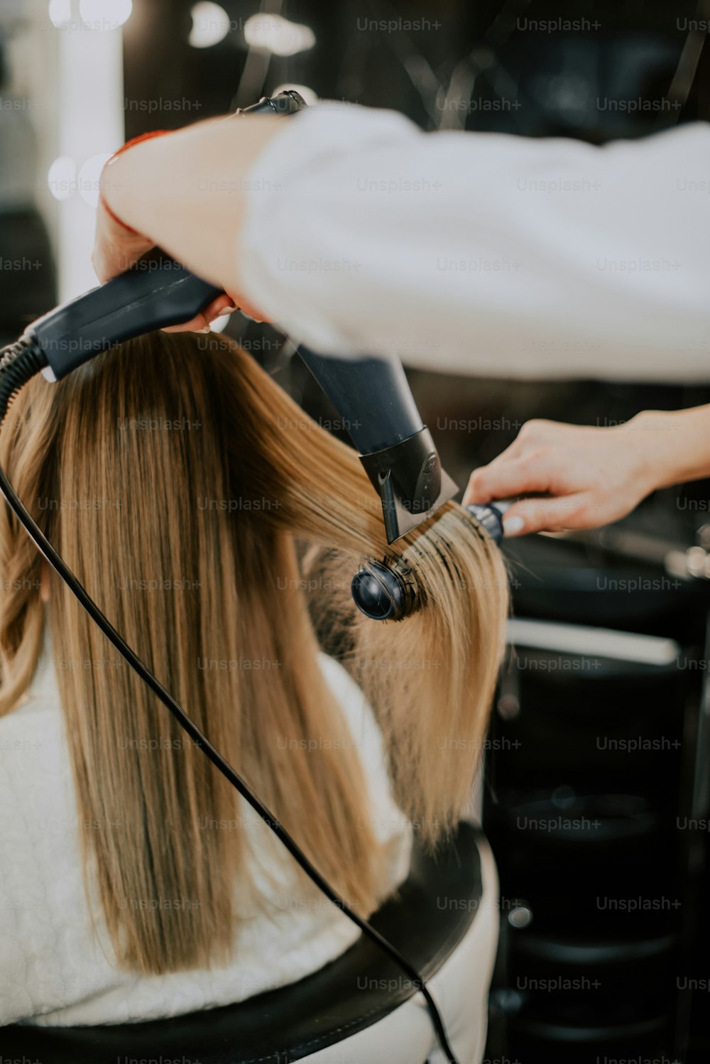 a person getting the hair done