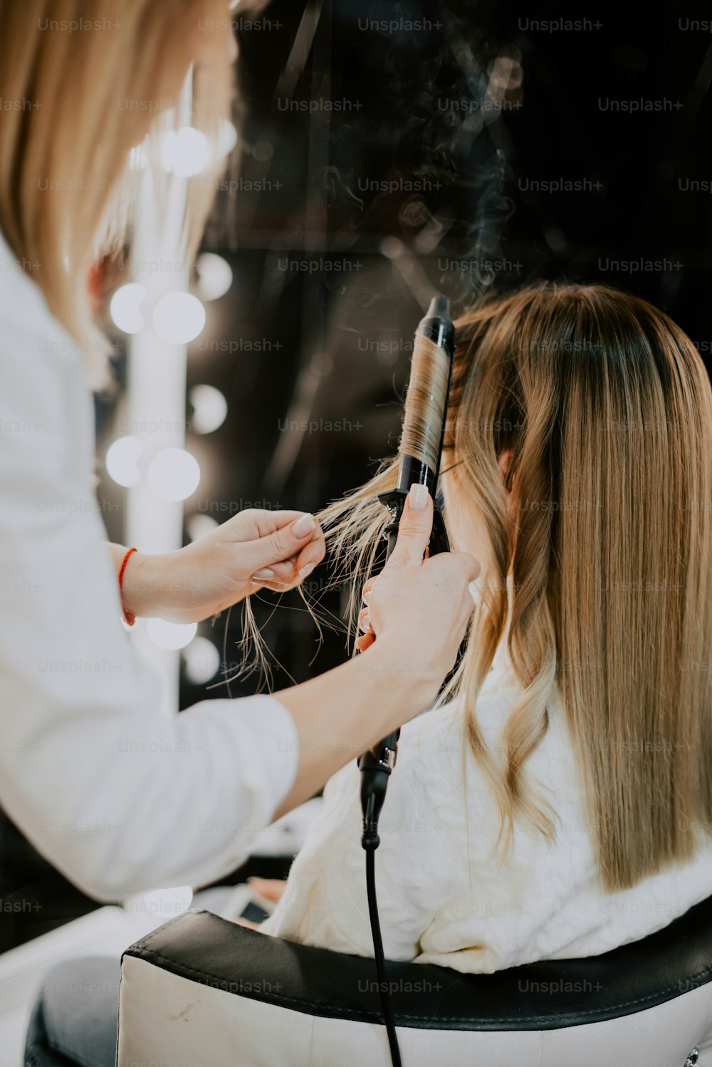 a person getting the hair done