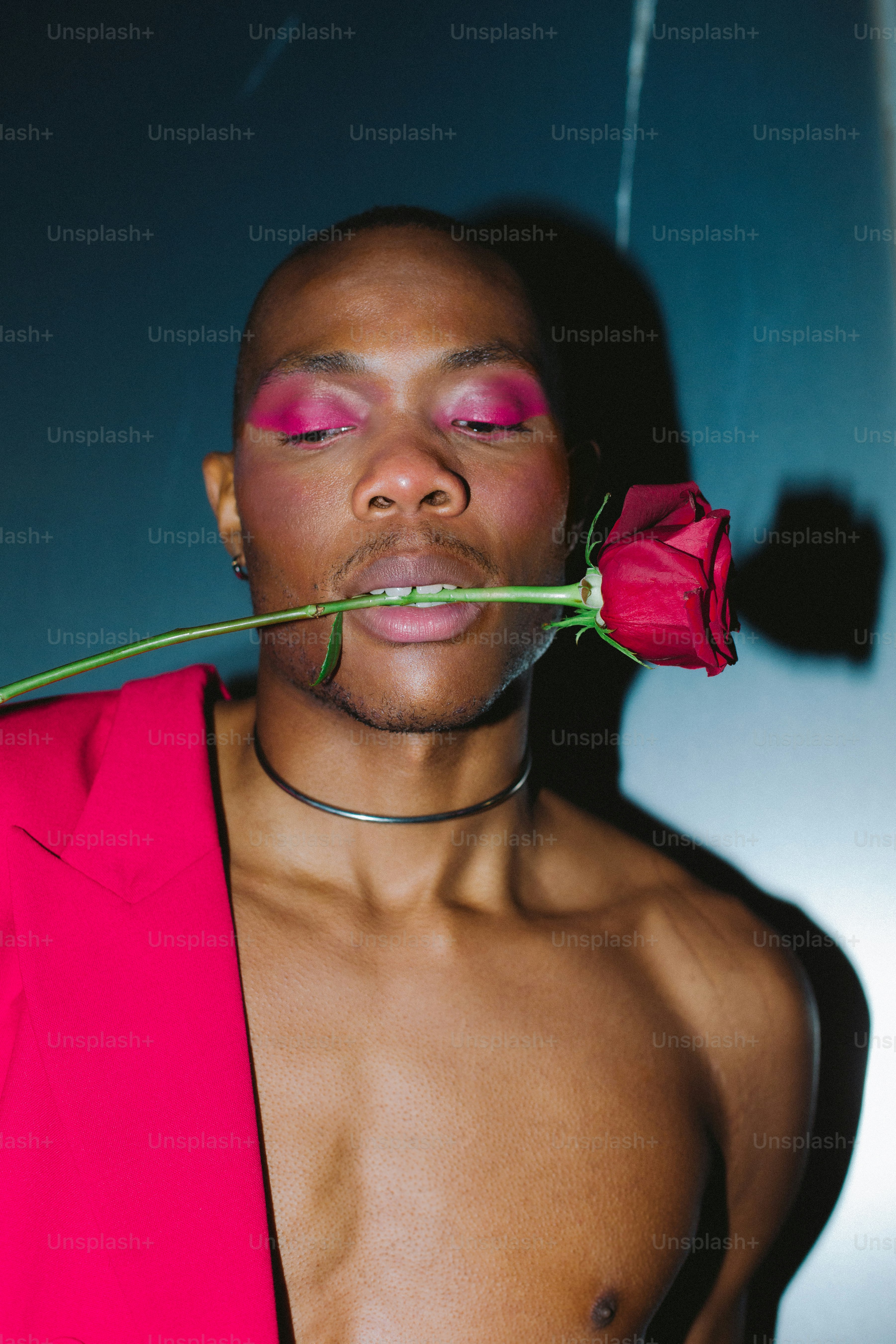 a person with a rose in the mouth