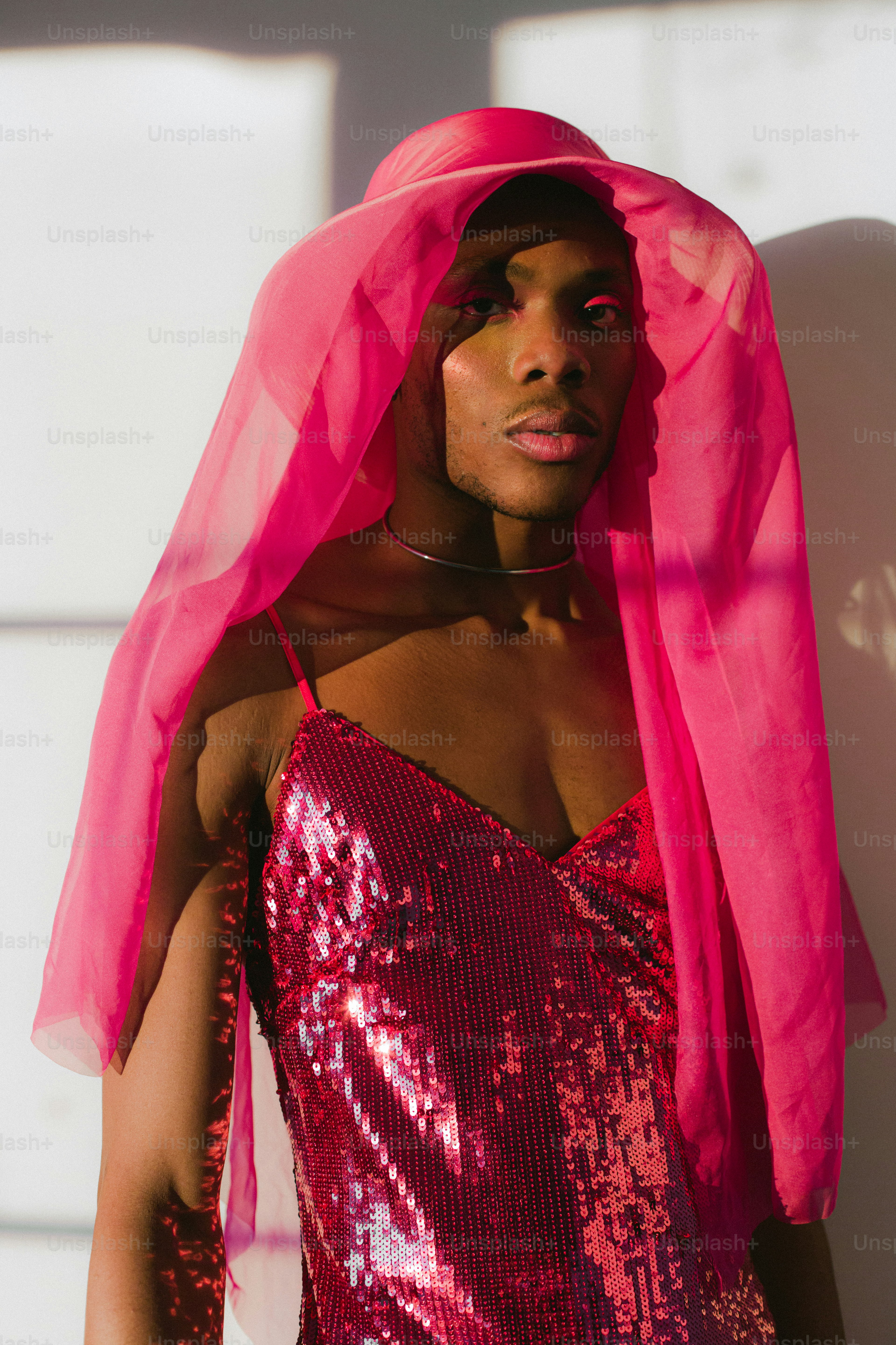 A person wearing a red robe photo – Party dress Image on Unsplash