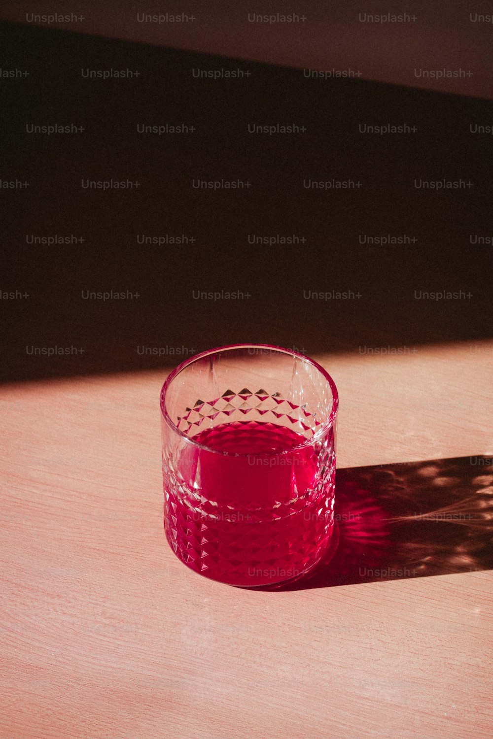 a glass of red liquid