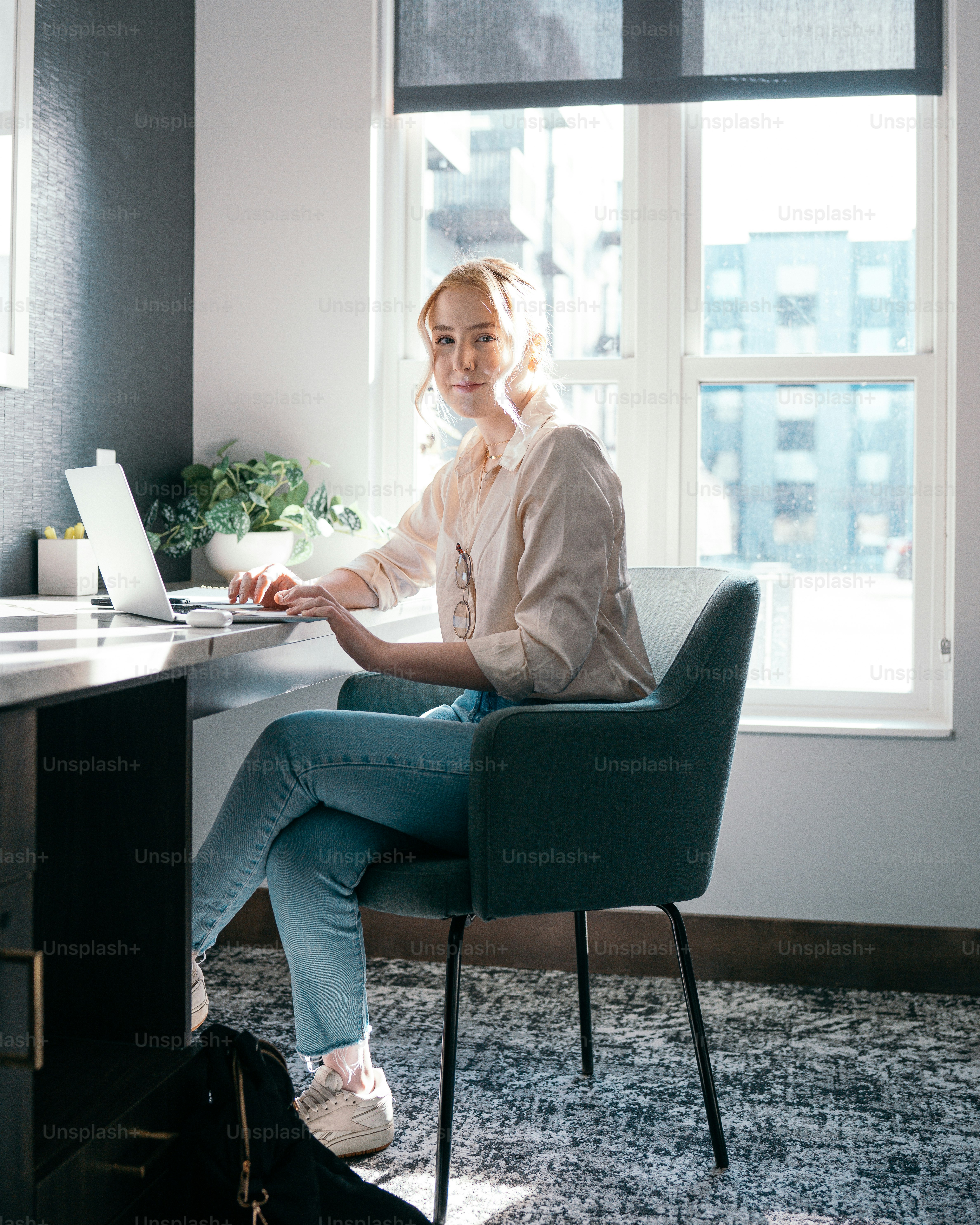 a woman sitting at a desk