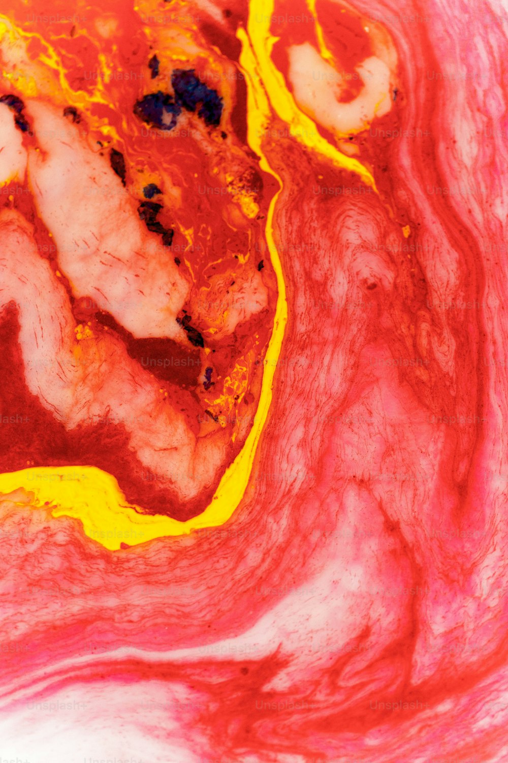 a close up of a red and yellow substance