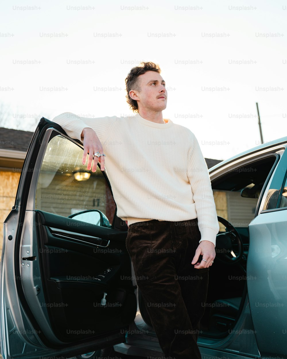 a man standing in a car