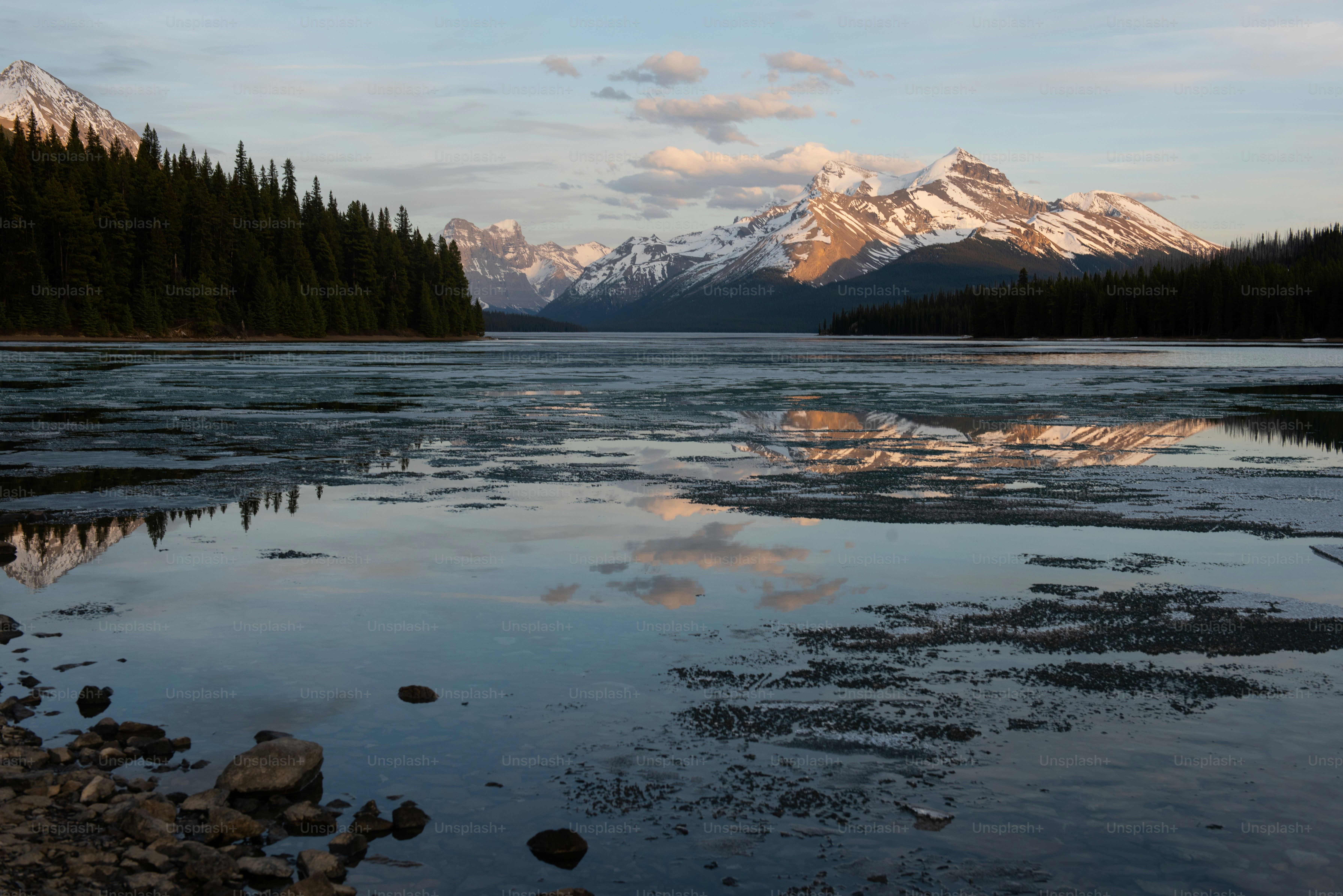 a lake with mountains in the background