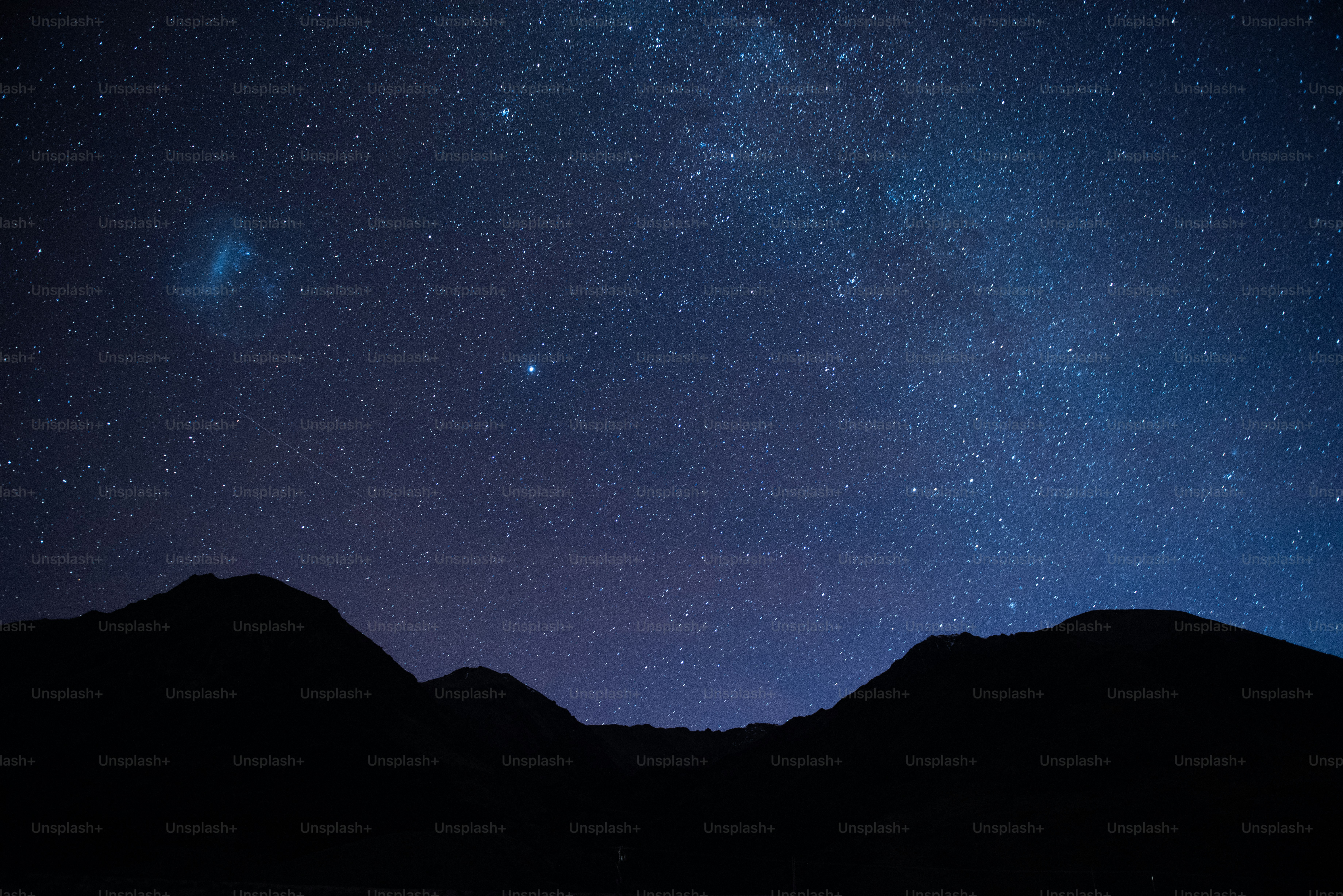 a mountain range with stars in the sky