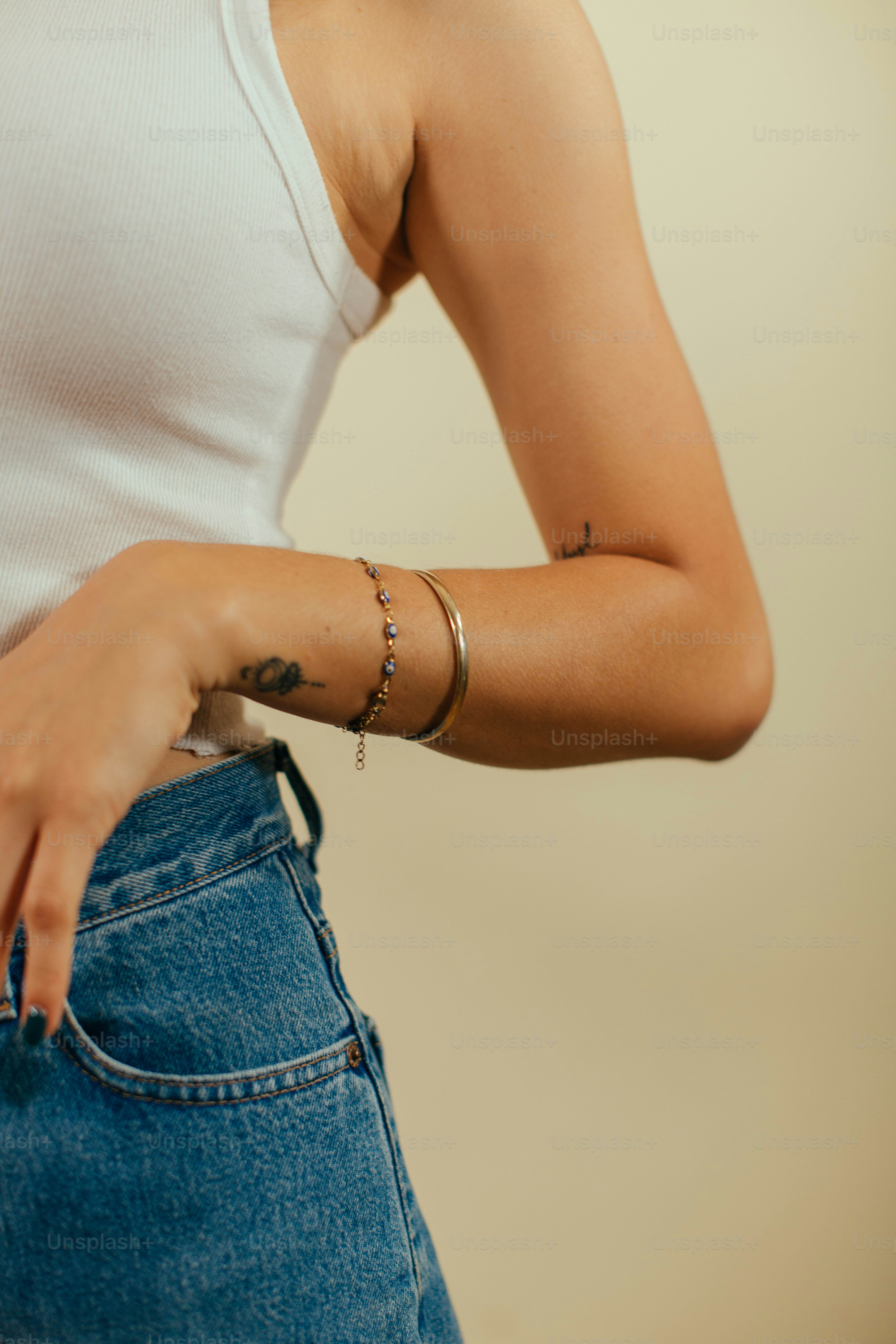 a woman with a tattoo on her arm