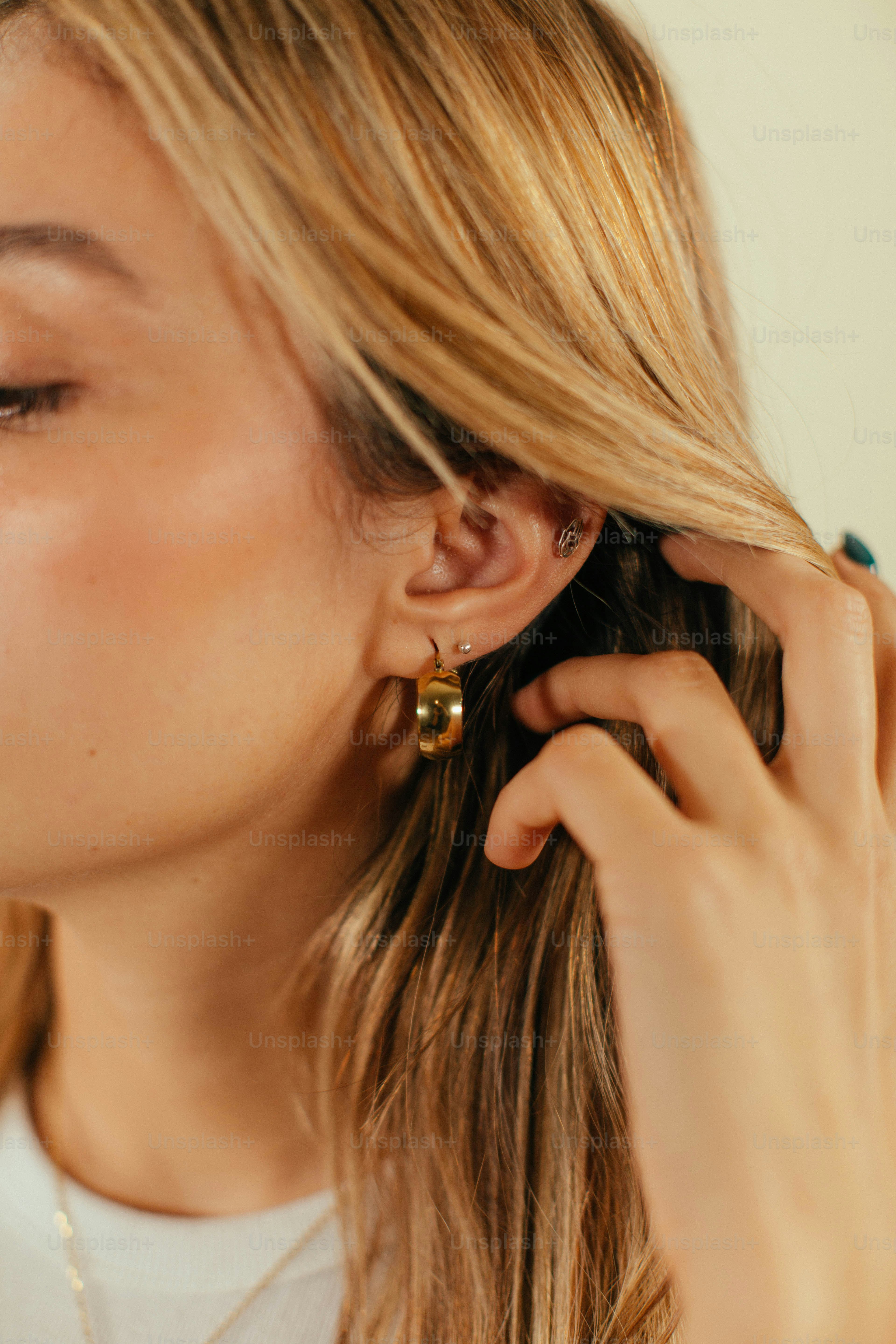 a woman with her hand on her face