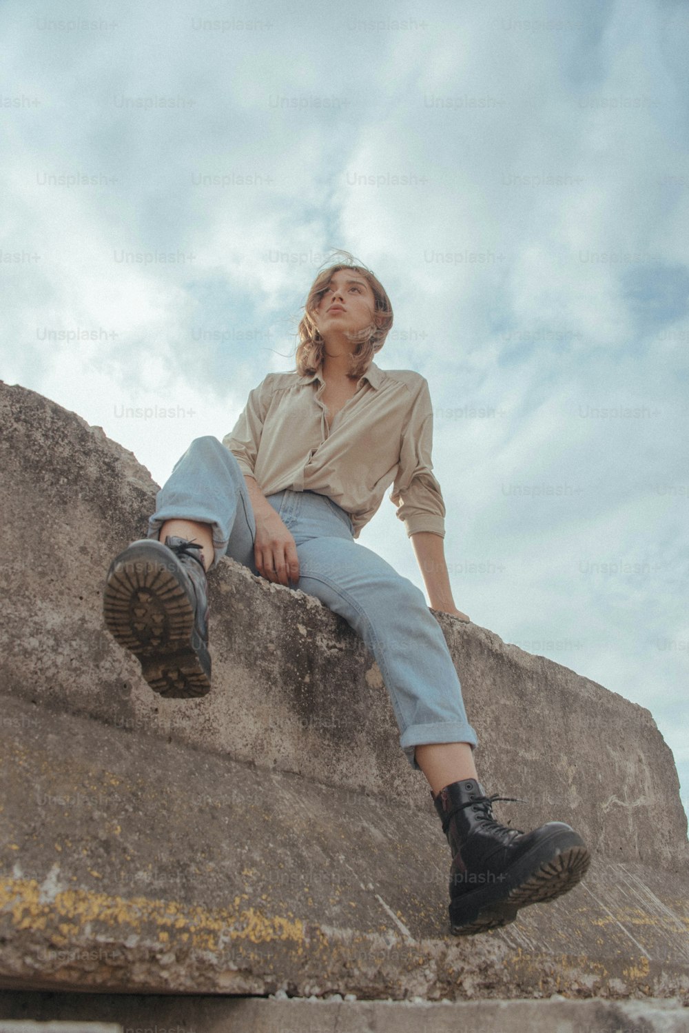 a man sitting on a rock