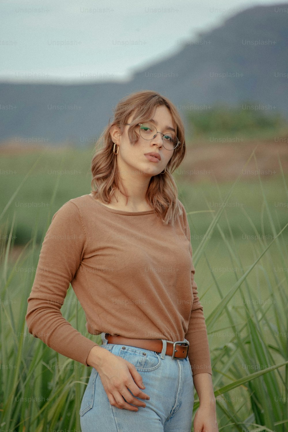 a woman standing in a field