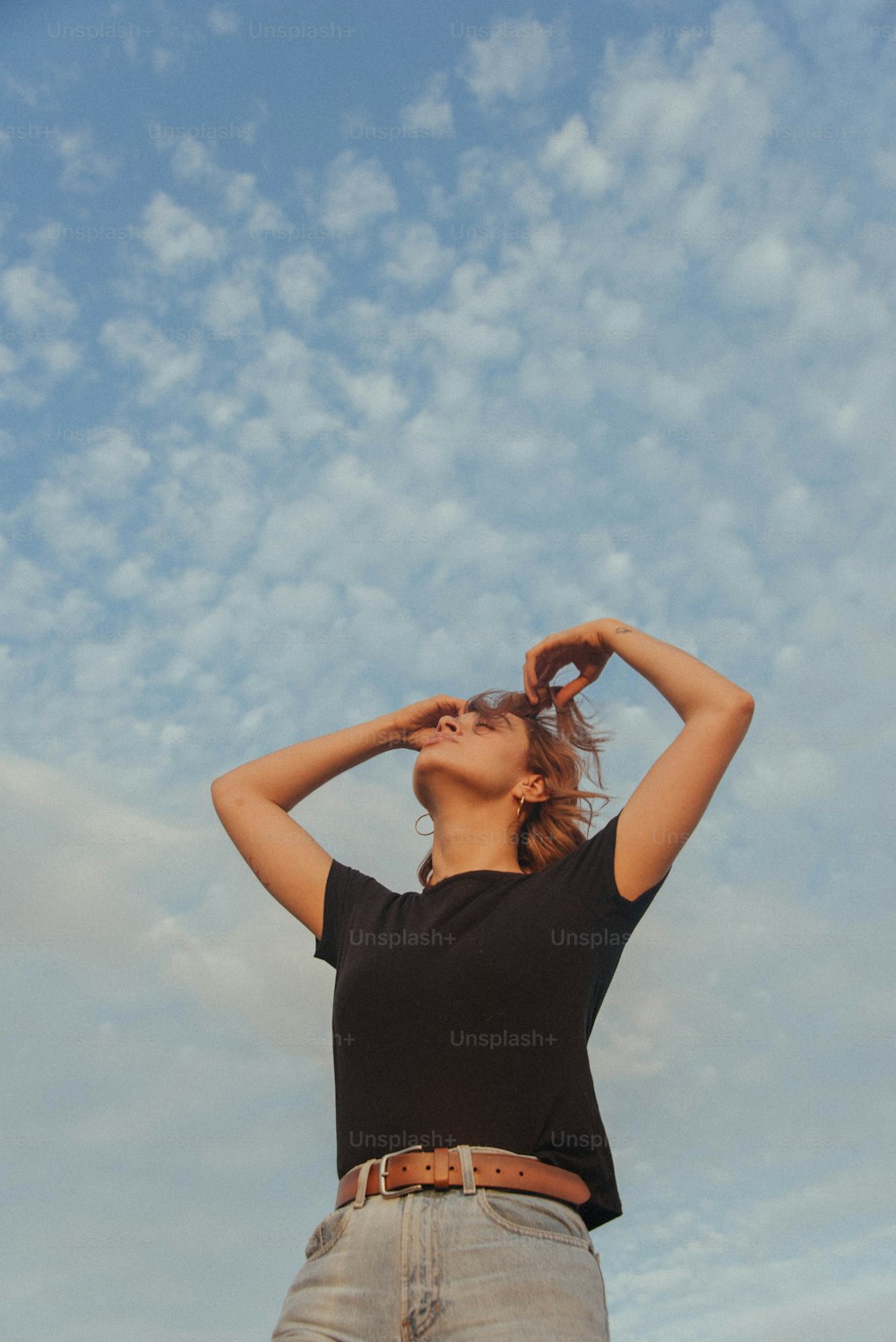 a woman with her hands in the air