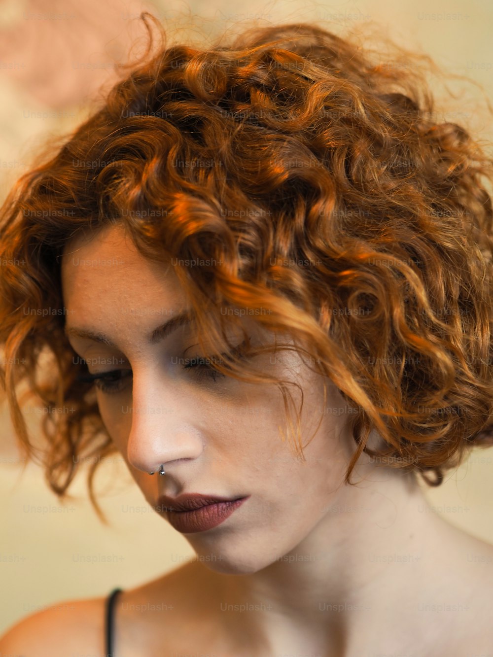 a woman with curly hair