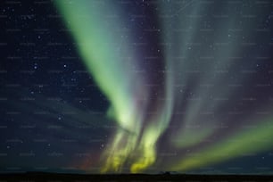 a green and yellow aurora borealis