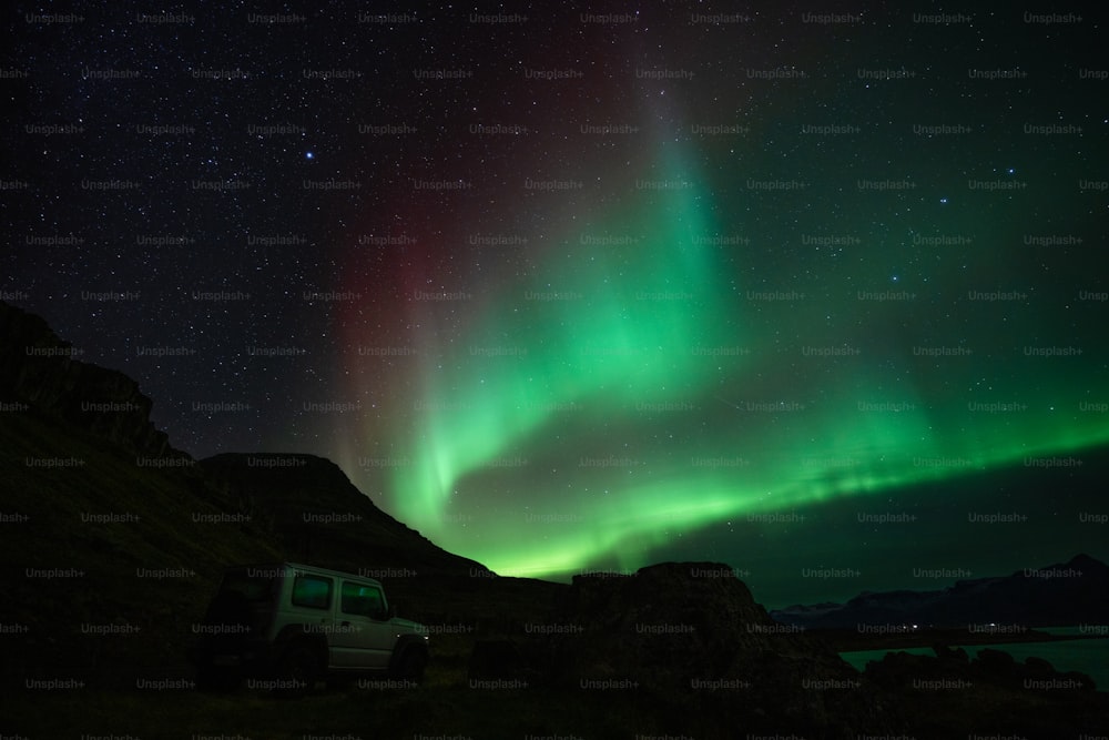 a car parked in front of a starry sky