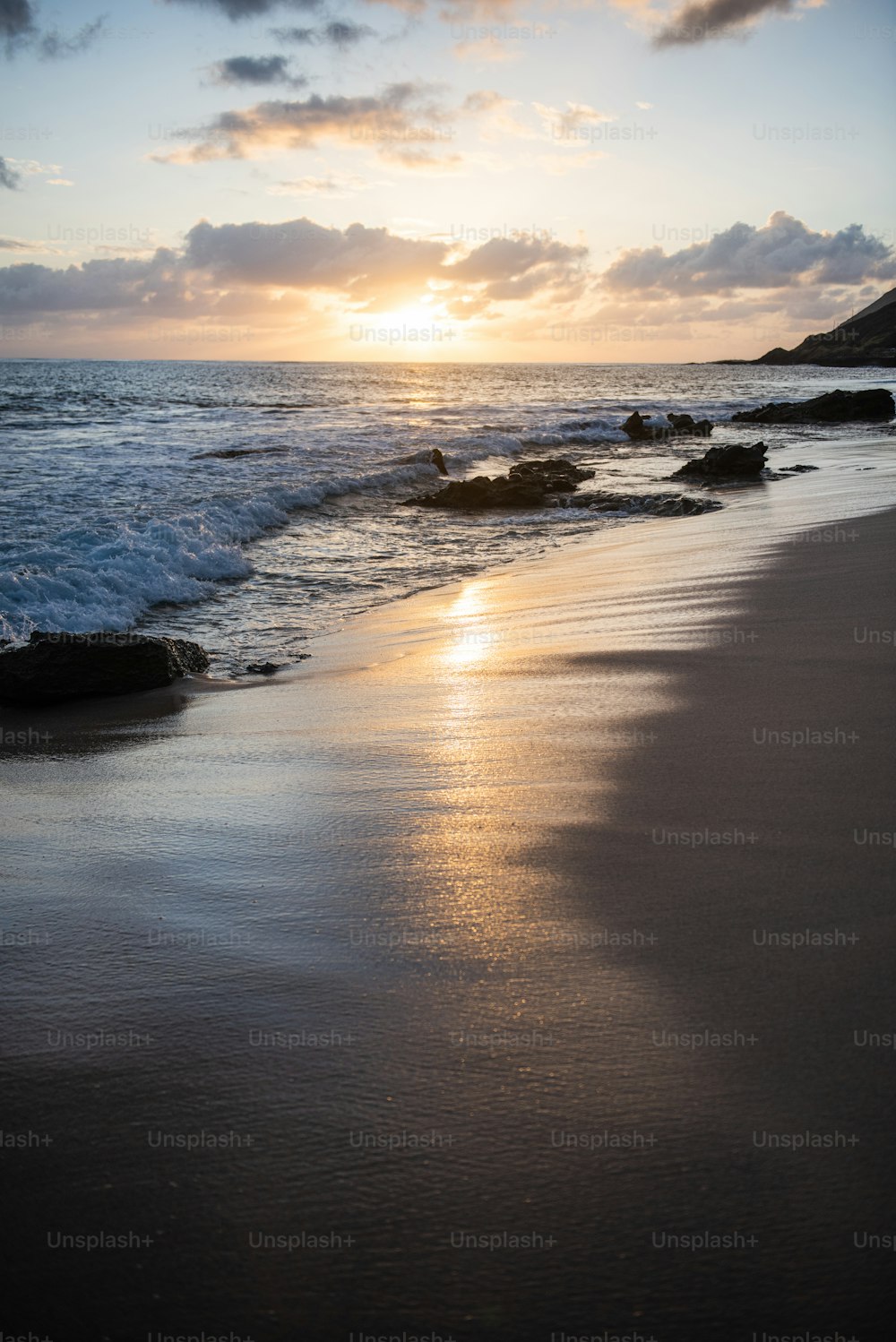 a beach with rocks and water