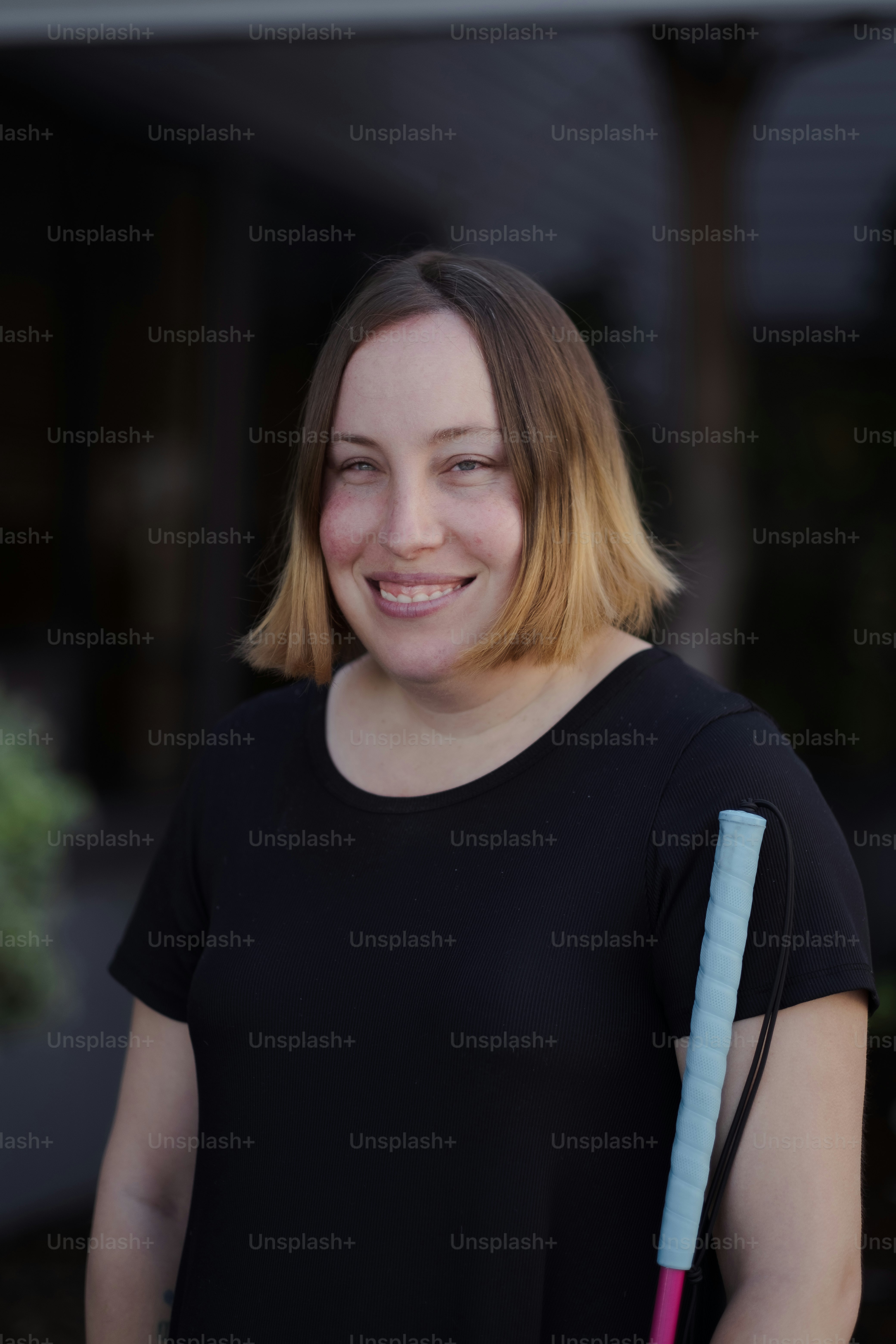 A person smiling at the camera photo – Guide cane Image on Unsplash