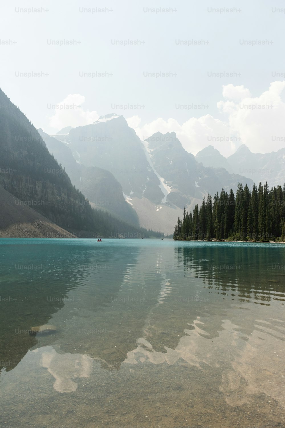 a lake with mountains in the background