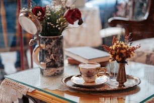 a vase with flowers on a table