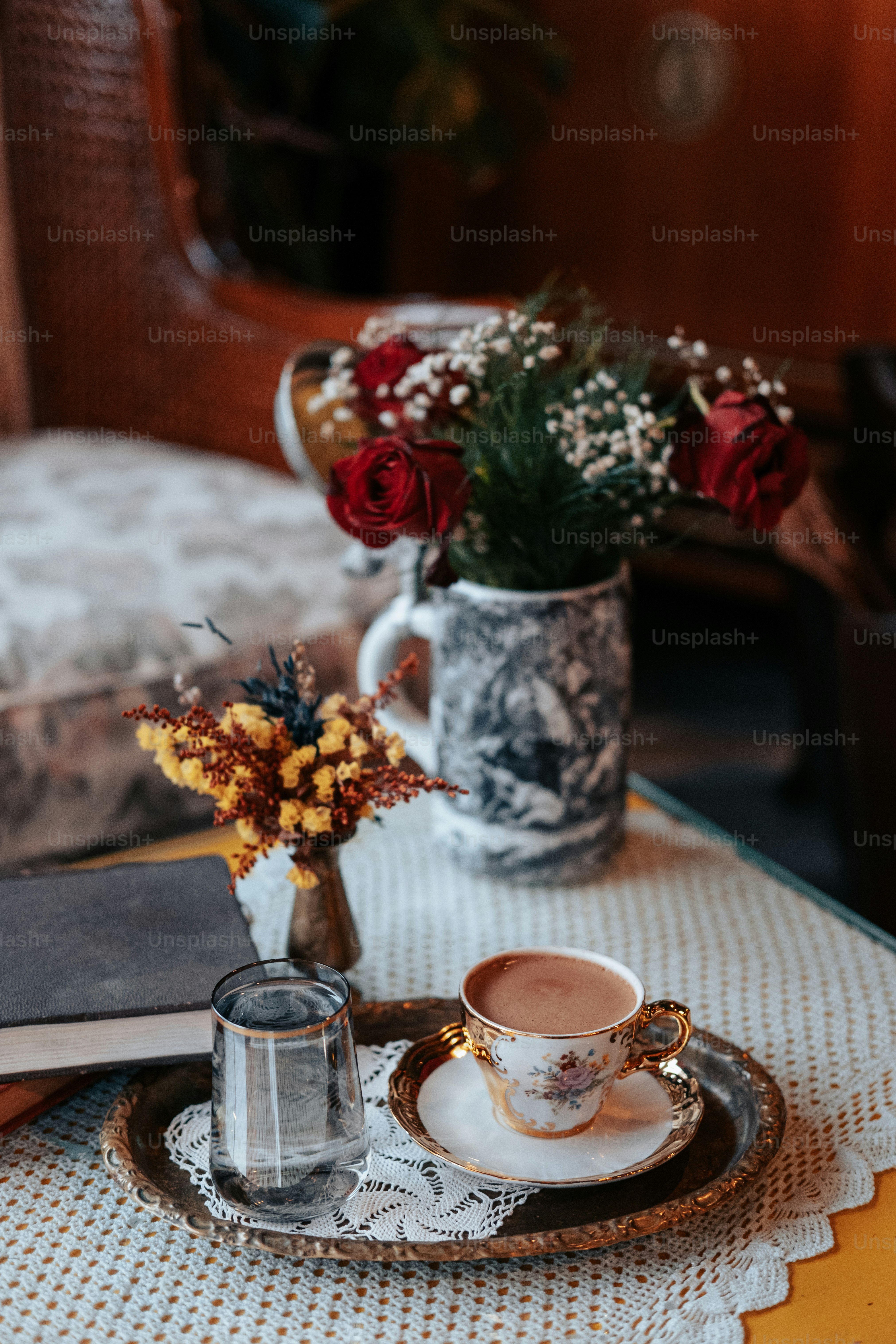 a vase with flowers on a table