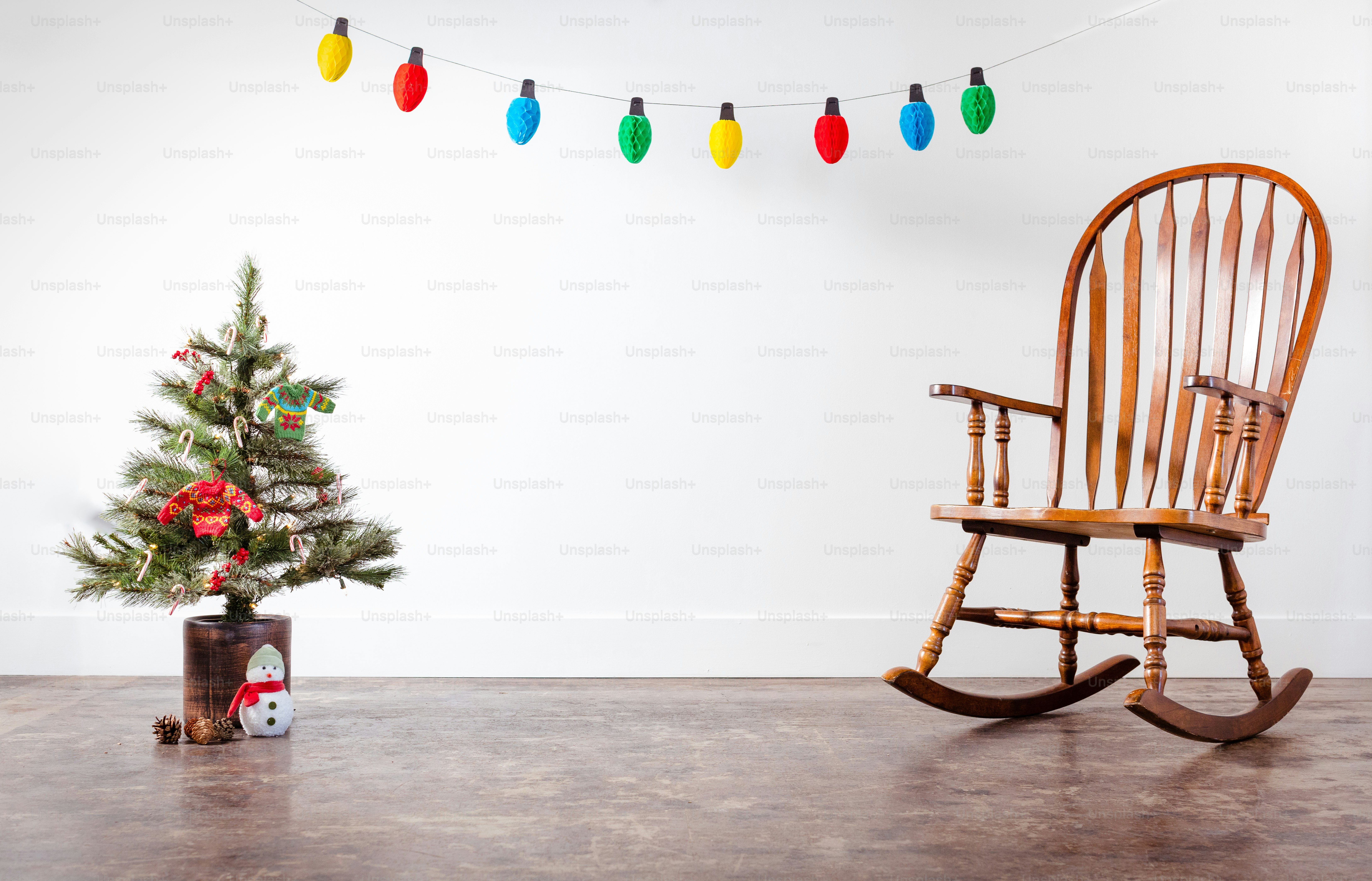 a chair and a tree with lights