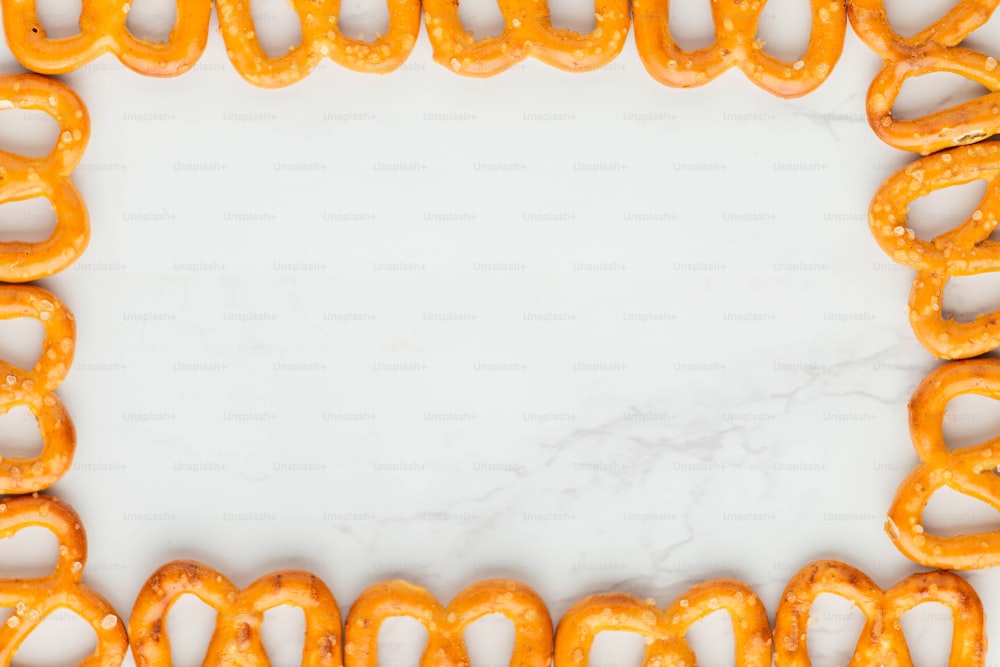 A close-up of a string of orange string photo – Pretzel Image on