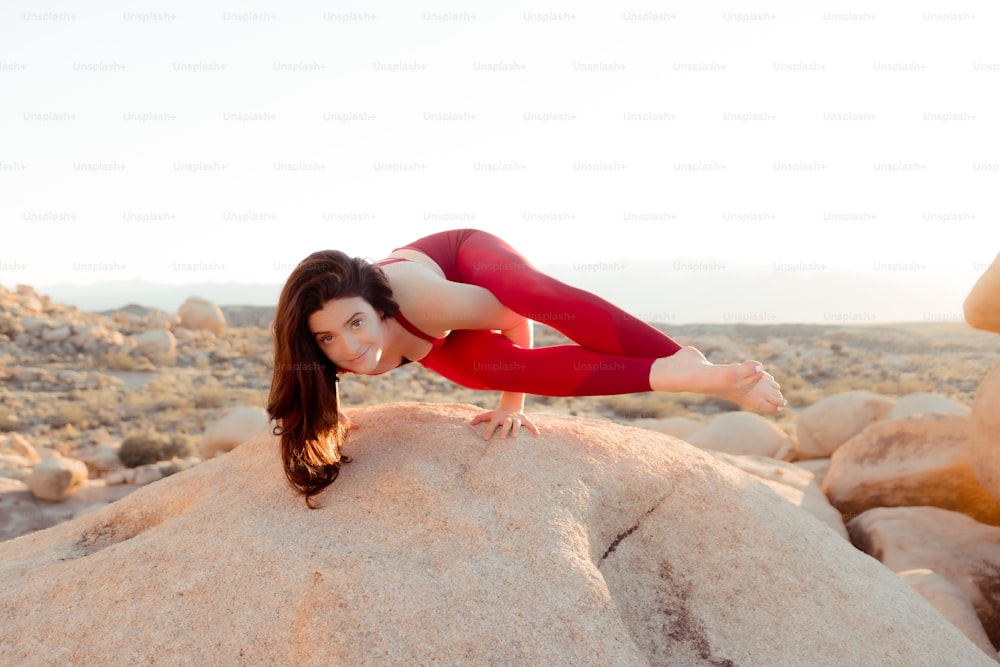 a person posing on a rock