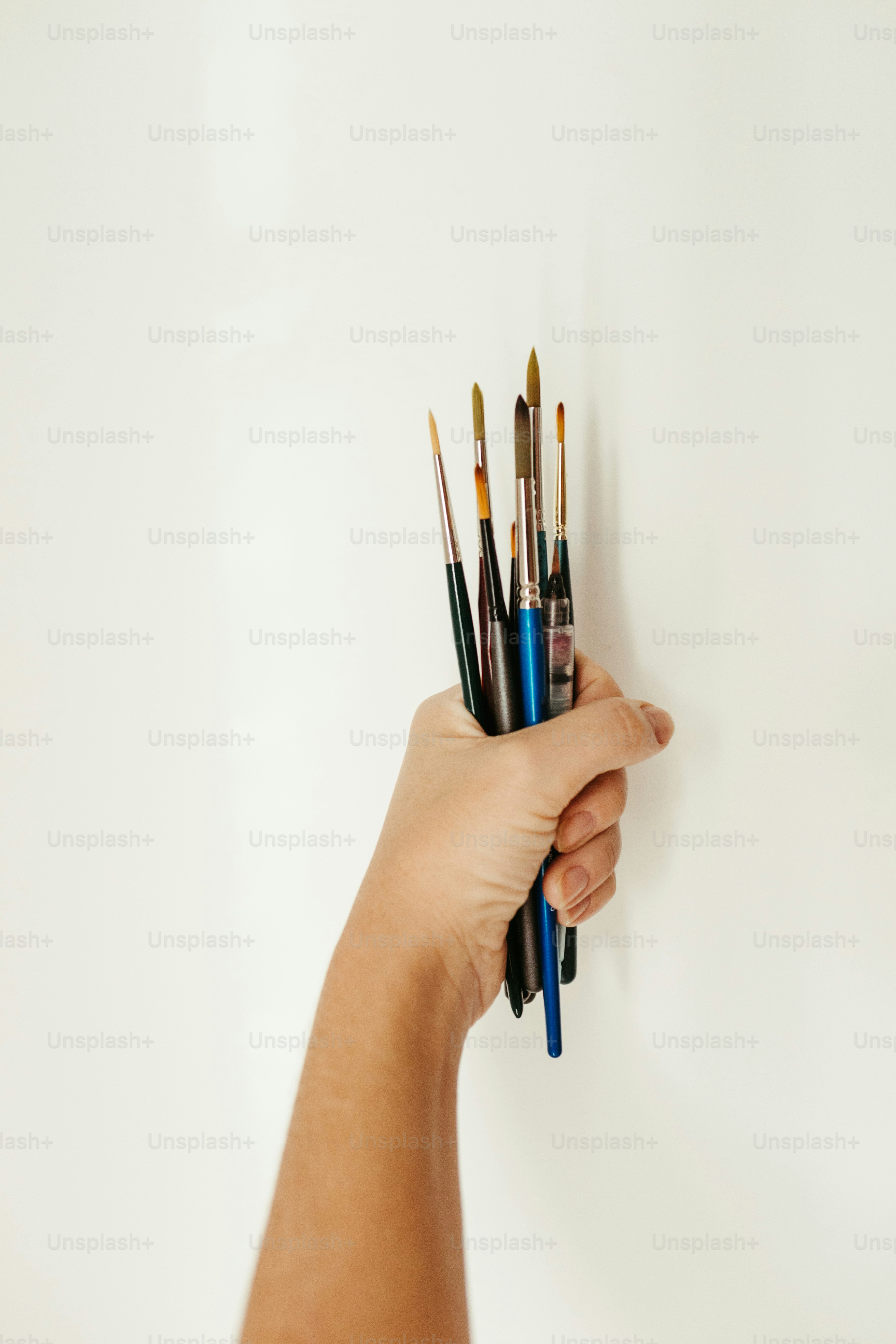 a hand holding a pen