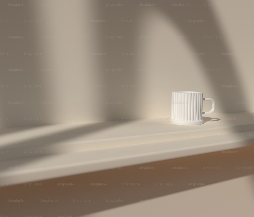 a white cup on a white surface
