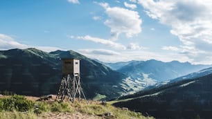 a tower in the middle of a mountain range