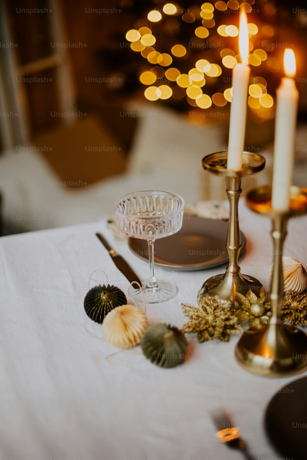 a table with candles and glasses