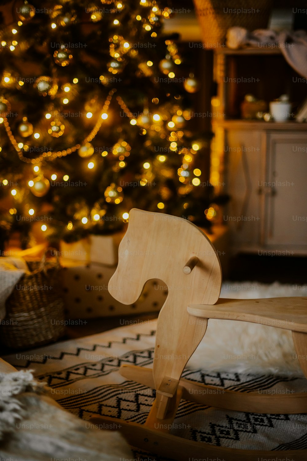 a chair in front of a christmas tree