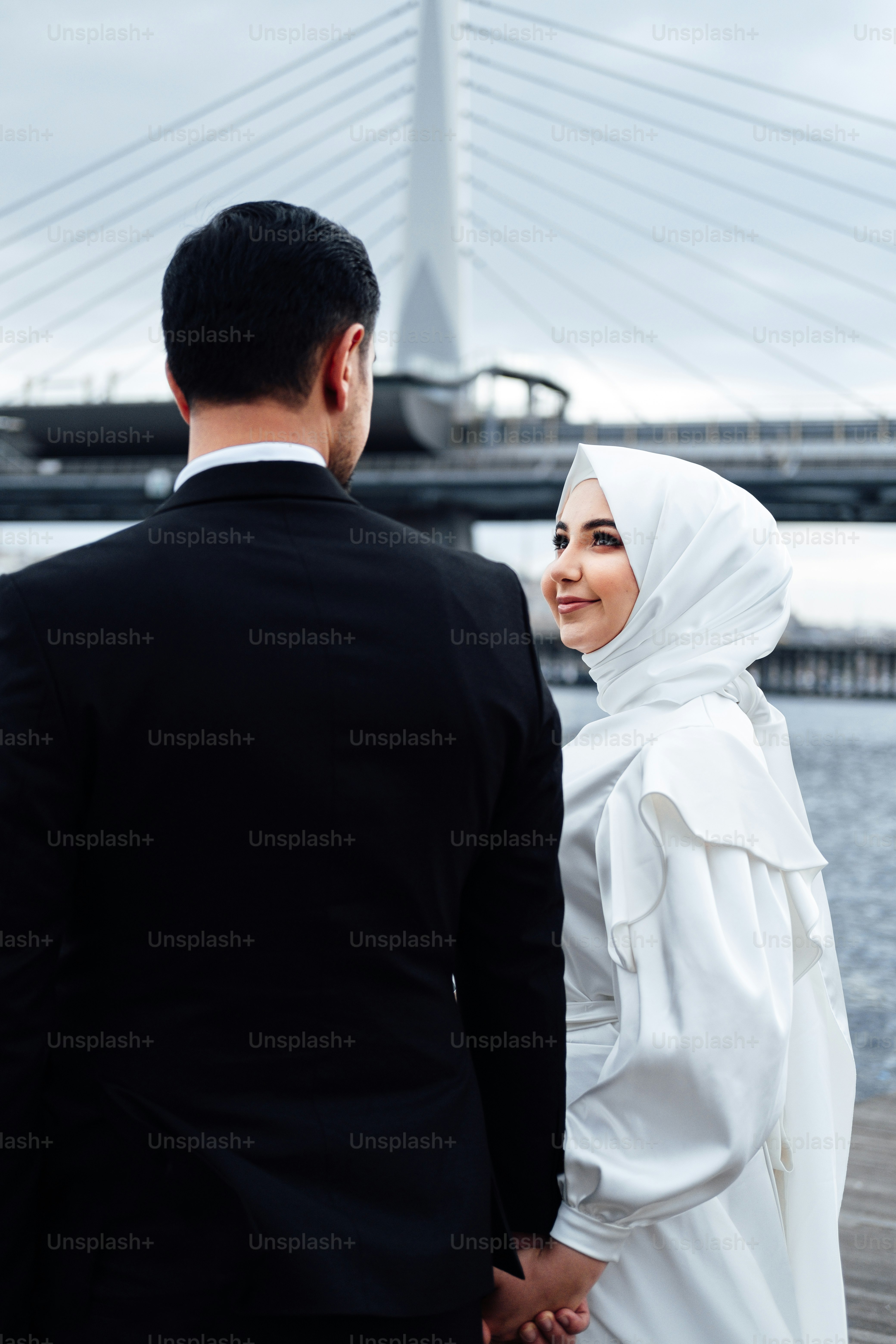 a man and woman in wedding attire