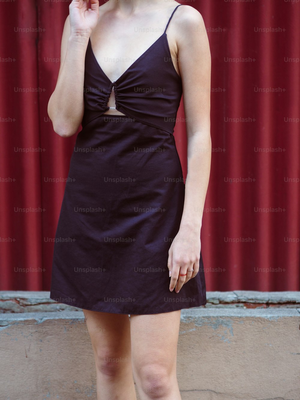 a woman wearing a black dress
