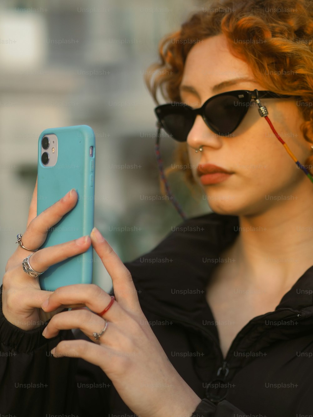 a woman holding a cell phone