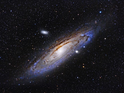 Photograph of space with stars and stardust.