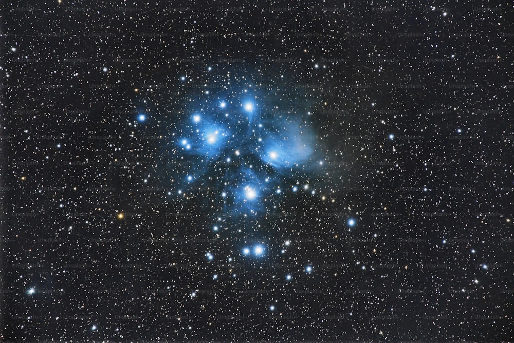 a starry night sky with a group of stars