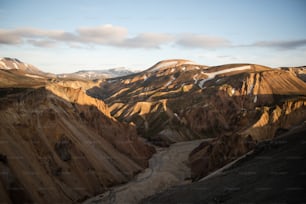 a rocky canyon with a river running through it