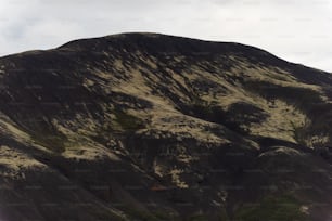 a mountain with a valley below