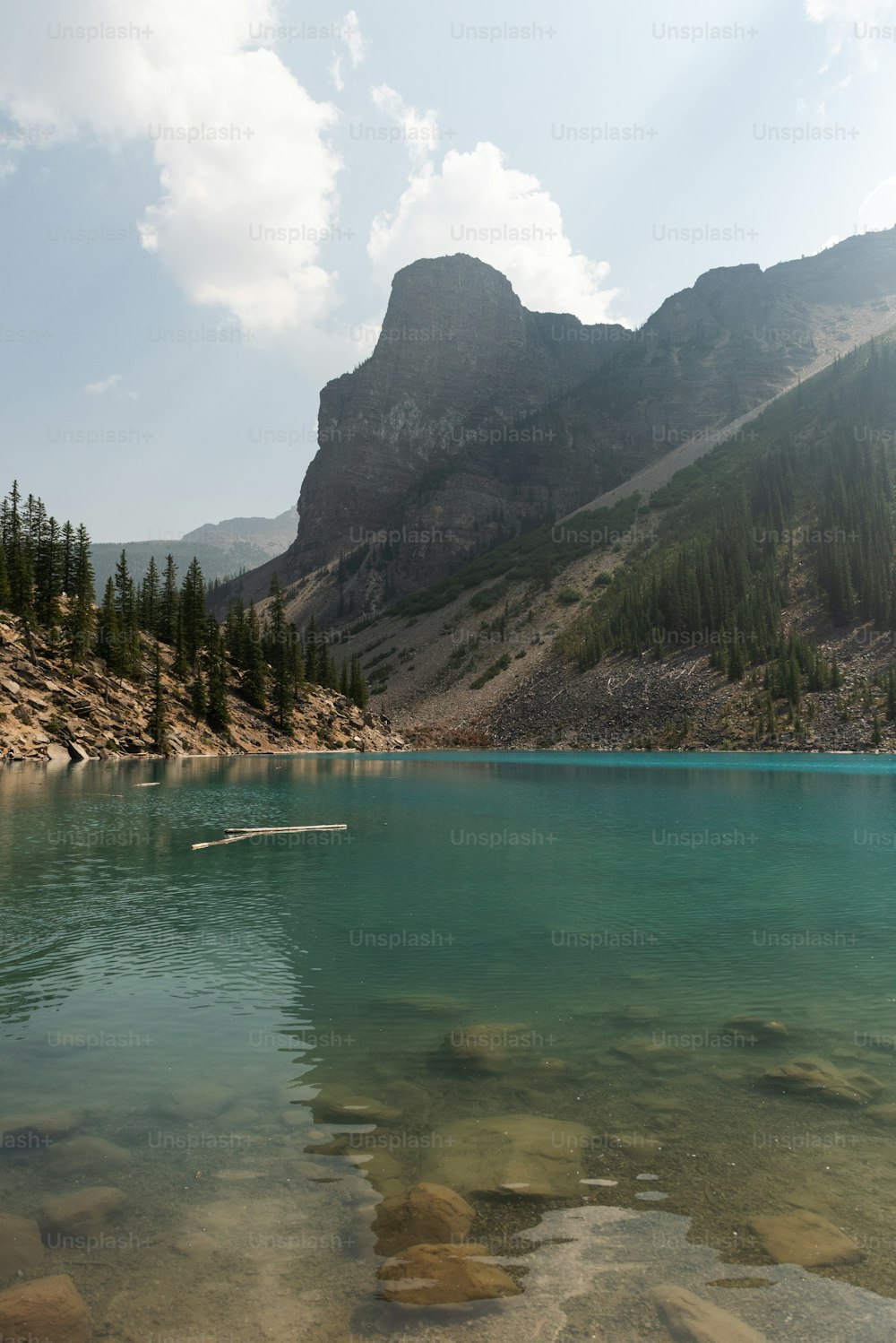 a body of water with a mountain in the background