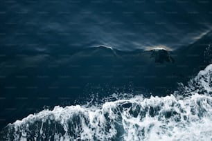 a wave crashing on a beach