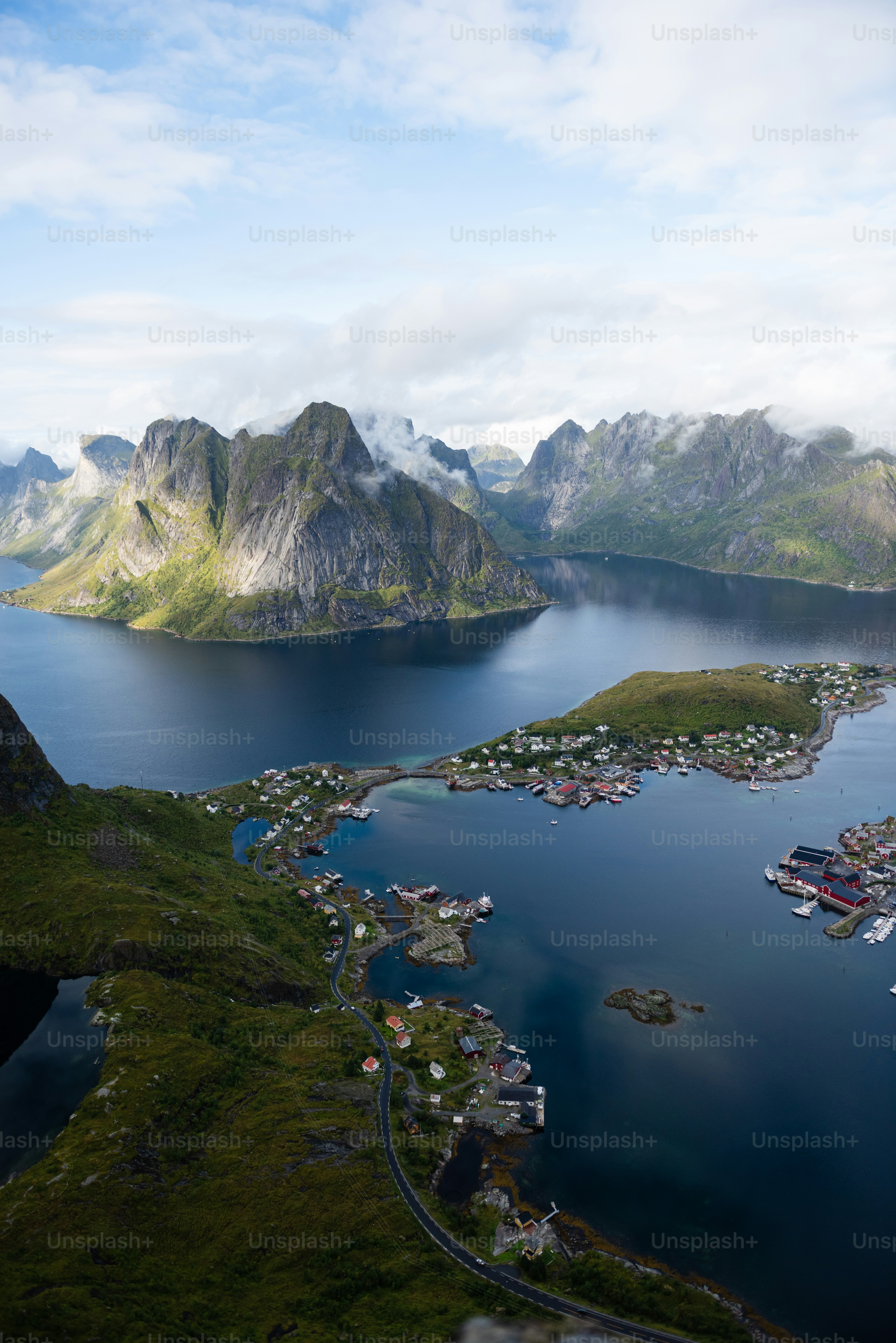 a body of water with mountains in the back